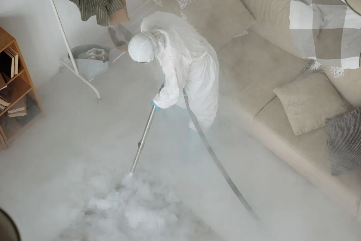 Biohazard cleanup technician in protective equipment, Downtown Los Angeles, Los Angeles, CA